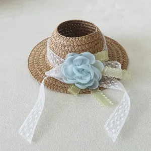 Woven doll straw hat with blue flower lace ribbon, cute plush toy accessory for dress up.