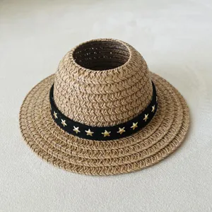 Miniature woven straw hat doll accessory with black star ribbon for stylish doll clothing display.