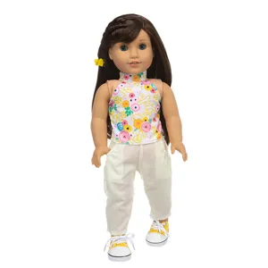 Detailed shot of 18-inch doll spring summer outfit, floral top, pants and sneakers.