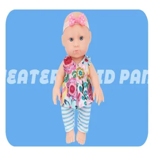 Detailed view of the 6.5 inch reborn baby doll featuring floral top, striped pants and cute headband.