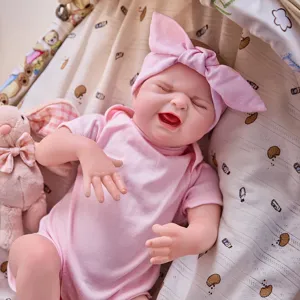 22 inch reborn baby doll vinyl simulation infant toy with pink clothes and bow headband detail view