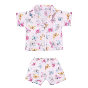 Pink butterfly print doll pajama set, detailed view of short-sleeve top and shorts.