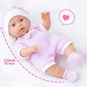 Detailed close-up of the 12-inch vinyl reborn baby doll in pink knit outfit and cute matching hat.