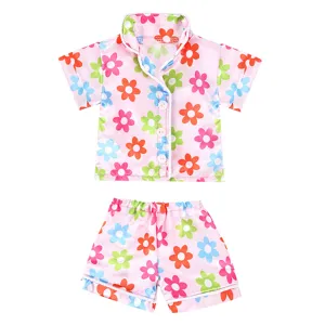 Doll pajama detail view, pink floral short sleeve shirt and shorts set for 43cm dolls.