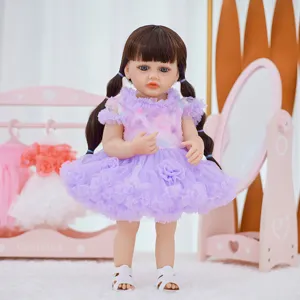 Detail shot of 22-inch reborn vinyl baby doll, cute purple dress, perfect for early education.