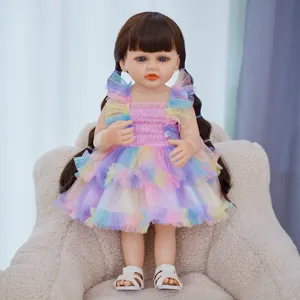 Detailed view of the 22-inch reborn baby doll, featuring soft vinyl body, colorful dress, cute hair.