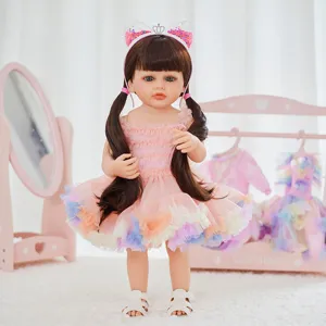 Detailed view of 22-inch reborn baby doll, full vinyl body with cute pink dress and cute hair.