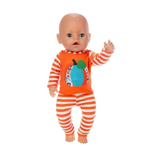 Detailed view of 45cm baby doll clothes set with pumpkin motif, orange and white stripes for dolls.