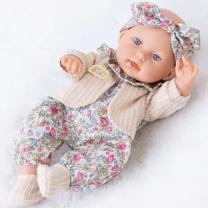Bambola reborn 30cm in vinile completo simulazione neonato con vestito floreale.