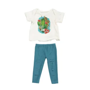 18 inch American girl doll clothes set with white cactus graphic t-shirt and blue distressed leggings detail.