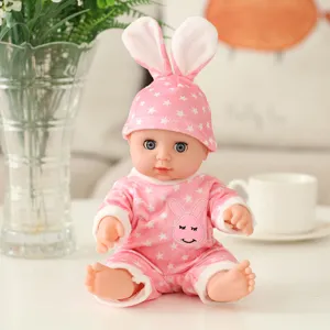 Adorabile bambola neonato in vinile da 30 cm con cappello da coniglio e tutina con stelle.