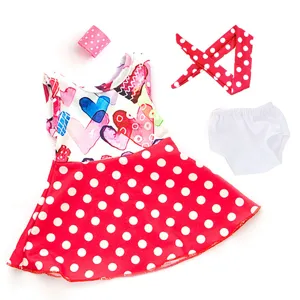 Close-up detail of the 18-inch doll outfit set featuring a heart dress and red polka dot accessories.
