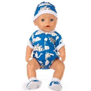Detailed view of cute doll clothes set with blue dinosaur print onesie, hat and socks.