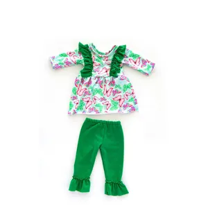 18-inch doll clothes set with butterfly print long-sleeve top and green ruffle pants.