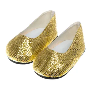 Nahaufnahme der goldenen Pailletten Puppenschuhe im Detail, glitzernde Textur und glatte Sohle.