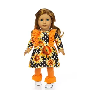 Detailed view of 18 inch American girl doll clothes sunflower dress with orange leggings.