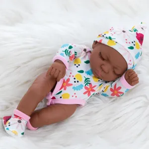 Close-up detail of 10-inch cute black reborn baby doll soft silicone body with floral outfit set.