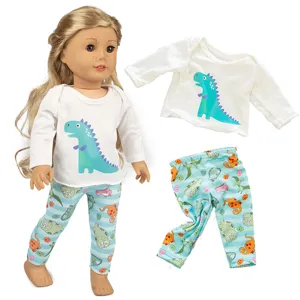 18 Zoll Puppenkleidung Set mit süßem Dinosaurier T-Shirt und gemusterter blauen Leggings.