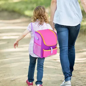 Pink purple doll backpack detail shot outdoor lifestyle child walking scene fashion accessory bag