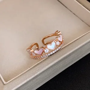 Detail shot of exquisite rose gold double-layer heart ring with sparkling cubic zirconia.