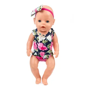 Detailed close-up view of 43cm baby doll wearing floral romper and matching hairband accessory.