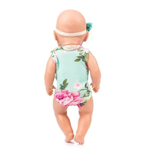 Detail view of 43cm baby doll outfit, cute floral romper and matching headband accessory.