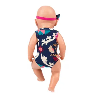 Detailed view of 43cm doll outfit with floral onesie and cute pink headband for baby dolls.