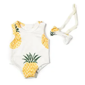 Pineapple print doll bodysuit and bow accessory set for 18 inch dolls detail view.