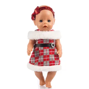 Detail shot of 43cm doll featuring christmas plaid dress and red sequin headband accessory.