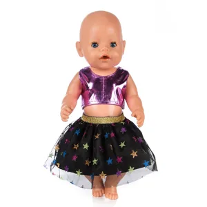 Detailed close-up view of a 43cm baby doll wearing a shiny purple top and star tutu skirt.