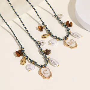 Bohemian woven anklet featuring pearls, shells, tiger's eye stone, and chic letter pendant.