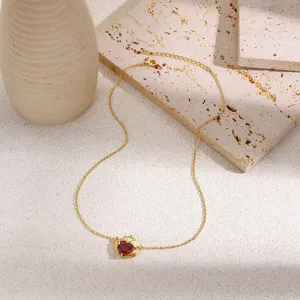 Gold crown heart necklace with red zircon stone, elegant hands holding heart clavicle chain for women