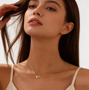 Close-up detail shot of the elegant paved heart lock and key pendant necklace worn on neck.