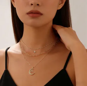 Multi-layer gold necklace with star and moon letter A pendant, stylish clavicle chain.