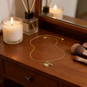 Detailed shot of gold-plated heart lock and key pendant clavicle chain necklace.