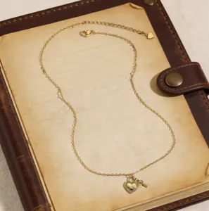 Gold heart lock key necklace with letter A pendant, delicate chain for daily wear charm.