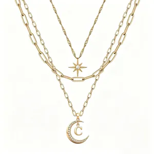 Gold layered necklace set with star and rhinestone crescent moon pendant initial C design.