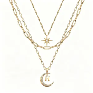 Multi-layer gold chain necklace featuring star and rhinestone moon letter H pendant.