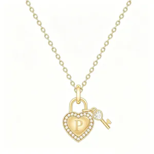 Close-up of gold heart padlock and key pendant necklace with crystal pave and letter P.