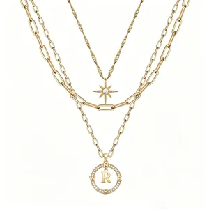 Collana a catena d'oro multistrato vintage con stella e ciondolo lettera bussola R