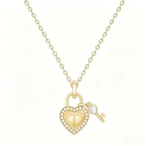 Detailed view of gold heart lock and key pendant necklace with crystal pave and letter T.