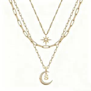 Multi-layer star moon necklace detail, elegant gold chain with sparkling diamond pendant.