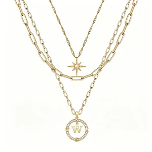 Collana multistrato dorata con ciondolo bussola lettera W e stella esagramma moda donna