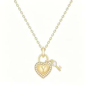 Close-up detail of the gold heart padlock pendant necklace with sparkling crystals and letter Y.