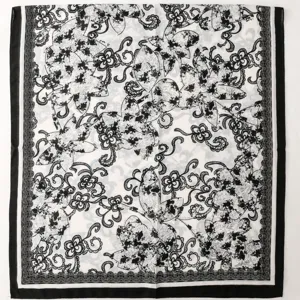 Detailed view of French vintage black and white floral print long scarf with elegant lace design.