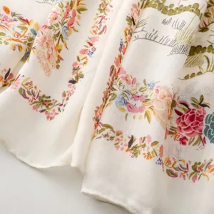 Detailed view of french pastoral style floral printed scarf, soft linen texture fabric.