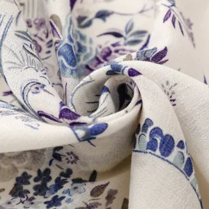 Close-up of french pastoral floral and bird print scarf fabric, showing fine cotton linen texture.