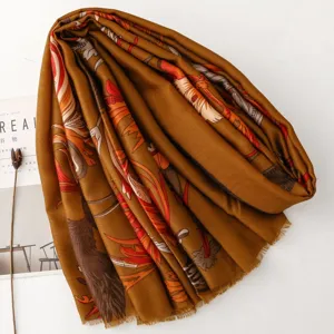 Vintage retro style printed scarf detail showcasing intricate feather motifs and soft texture.