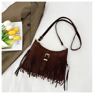 Vintage brown suede fringe crossbody bag for women, stylish shoulder handbag with metal buckle.