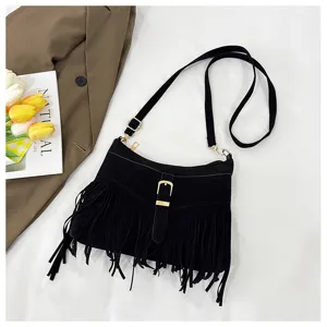 Black suede fringed crossbody bag for women, vintage retro shoulder bag with gold buckle.